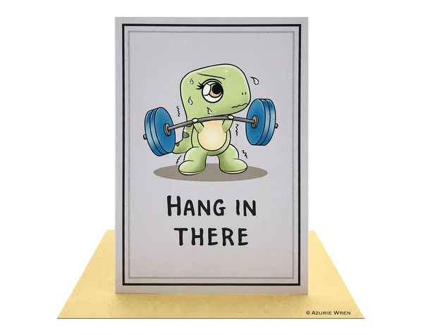 Cute greeting card with Baby T-Rex weightlifting with hang in there text.